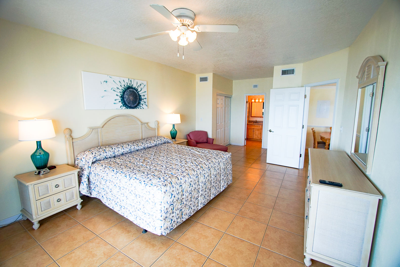 An airy master bedroom at VRI's Discovery Beach Resort in Cocoa Beach, Florida.